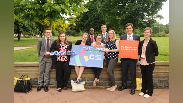 Group of advocates holding signs