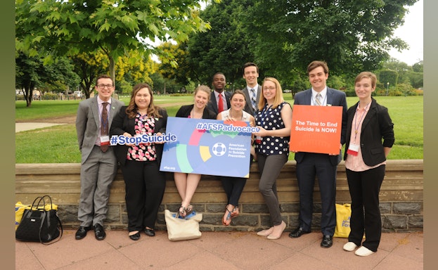 Group of advocates holding signs