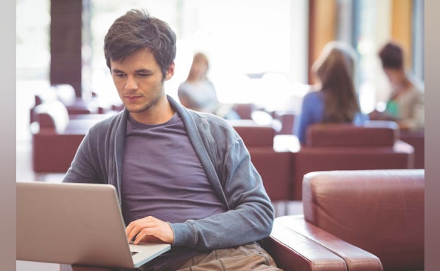 Stock image of man at computer