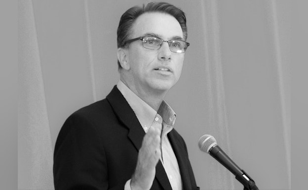 Man speaking at podium