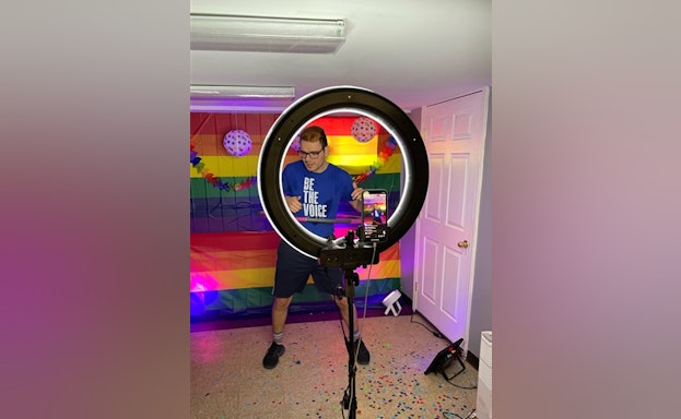 Man standing in front of photo light