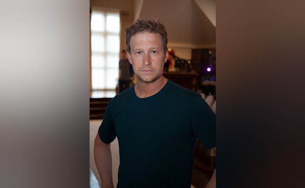 Man standing and facing camera