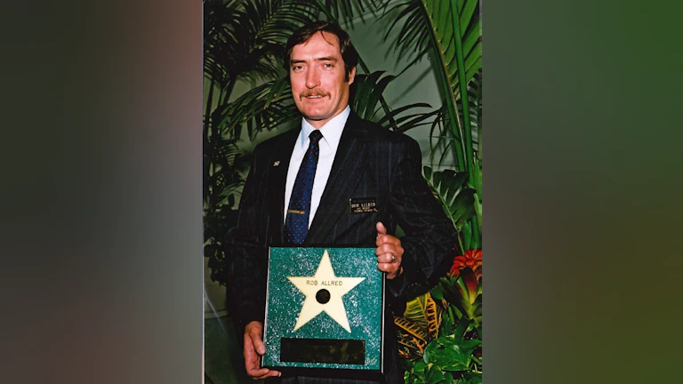 Man holding an award