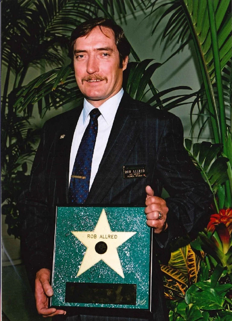 Man holding an award