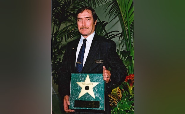 Man holding an award