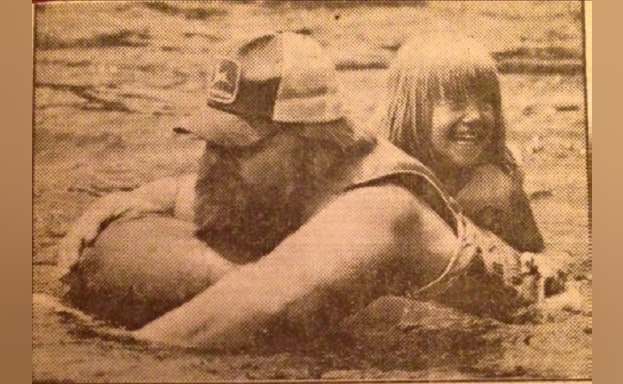 Man and child playing in water