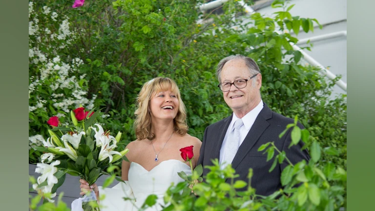 Man and woman among flowers