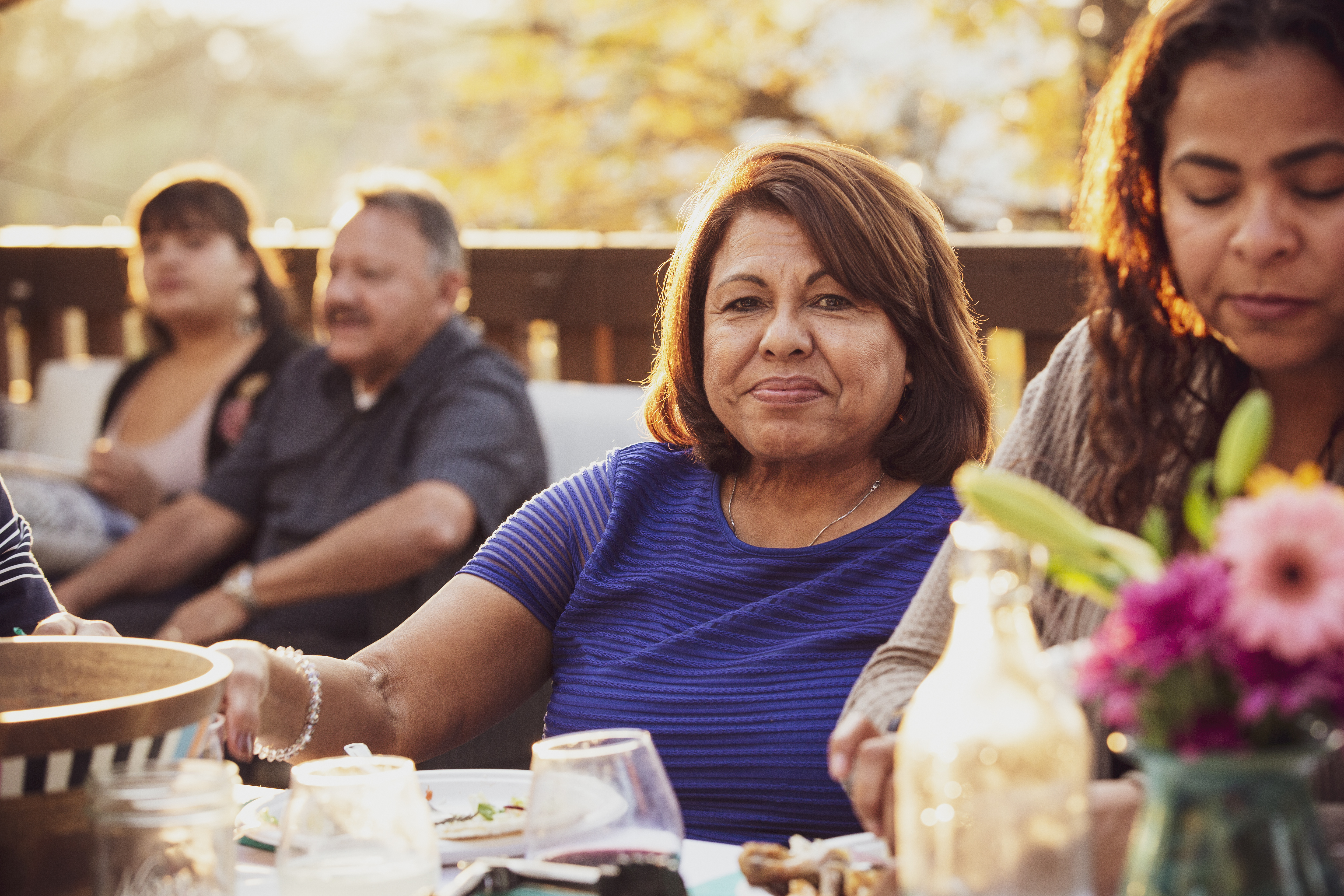 Hispanic family eating outdoors