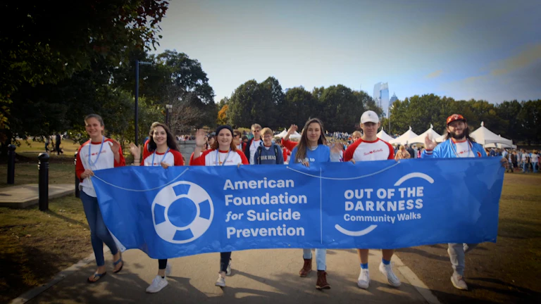 Group of walkers holding a banner