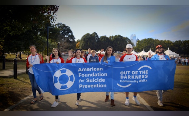 Group of walkers holding a banner