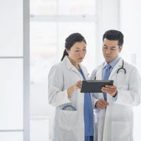 Two healthcare professionals talking