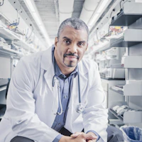 Physician sitting and facing camera