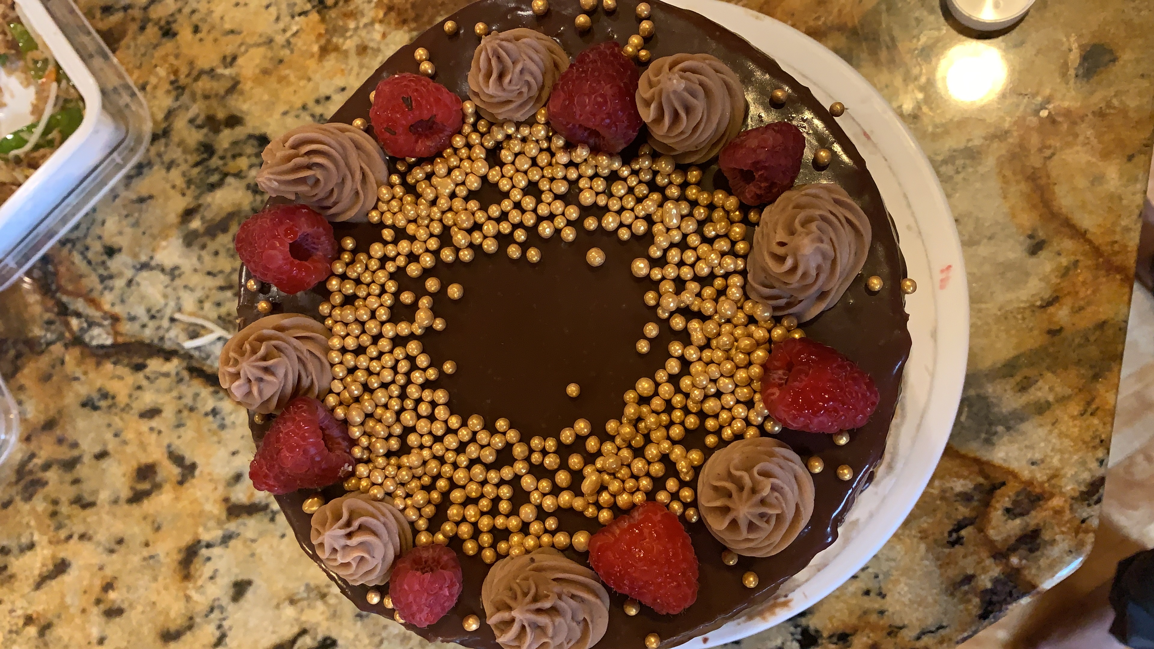 Chocolate cake topped with raspberries