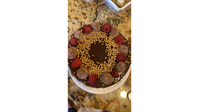 Chocolate cake topped with raspberries