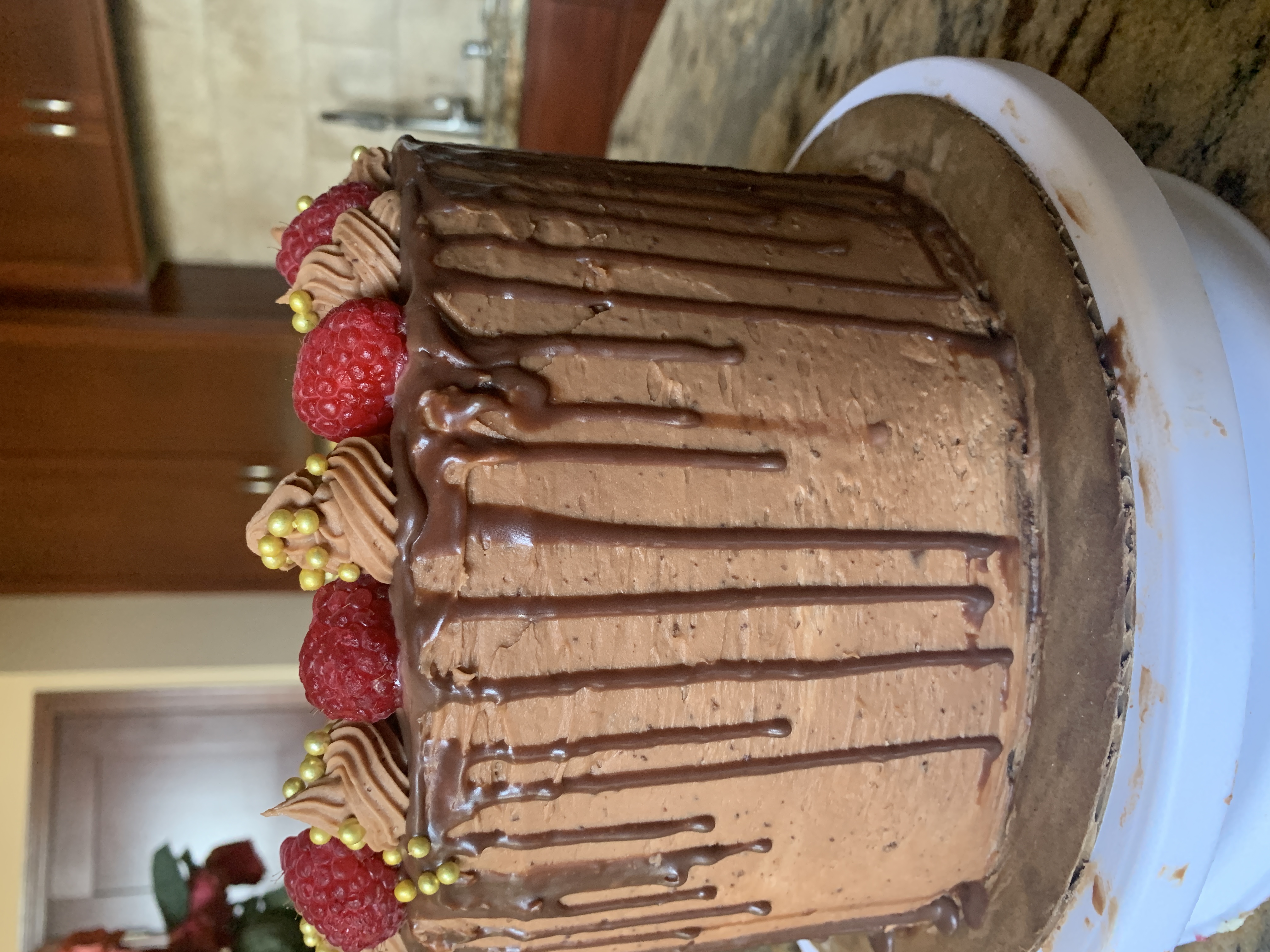 Chocolate cake topped with raspberries