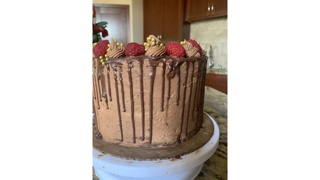 Chocolate cake topped with raspberries