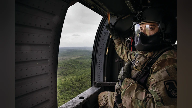 Soldier in helicopter