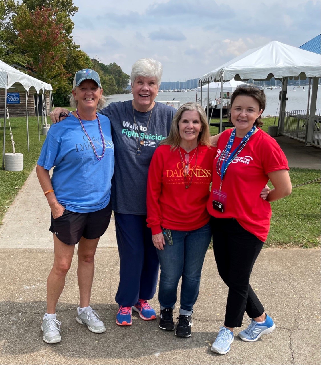 Four women pose for a photo together