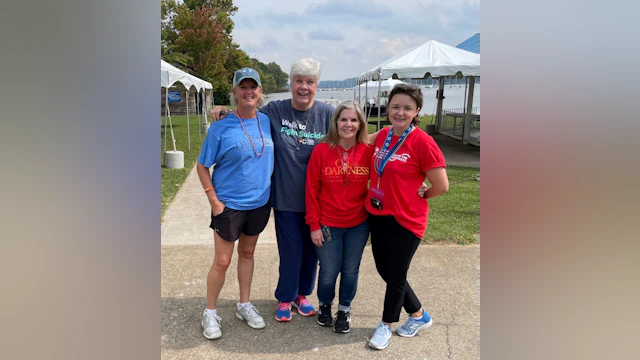 Four women pose for a photo together