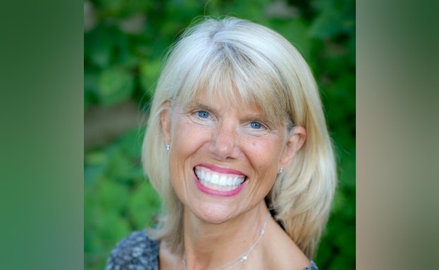 Headshot of Beverly smiling at the camera