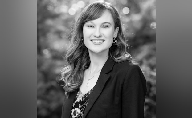 Headshot of Katie smiling and looking at the camera