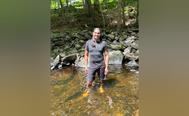 Kenny Cruz standing in shallow water.