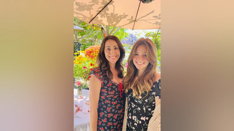 Elizabeth Marshall standing with her daughter.