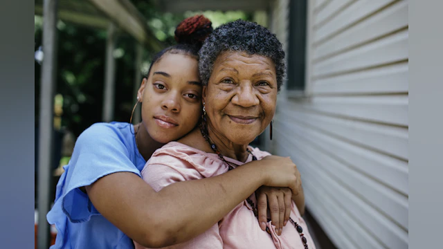 Grandmother and grandaughter smil