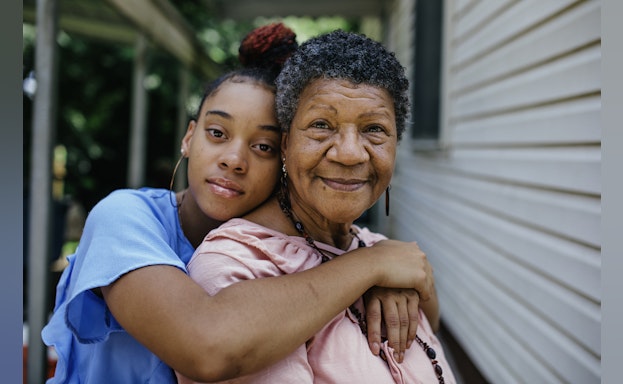 Grandmother and grandaughter smil