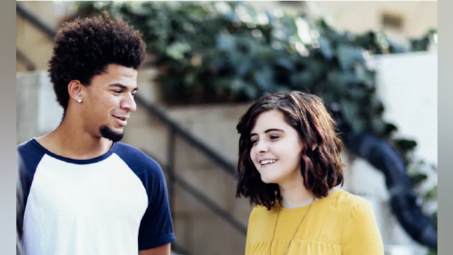 Young man and young woman talking