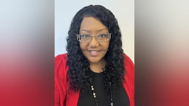 Headshot of Natasha King smiling at the camera