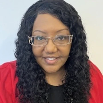 Headshot of Natasha King smiling at the camera