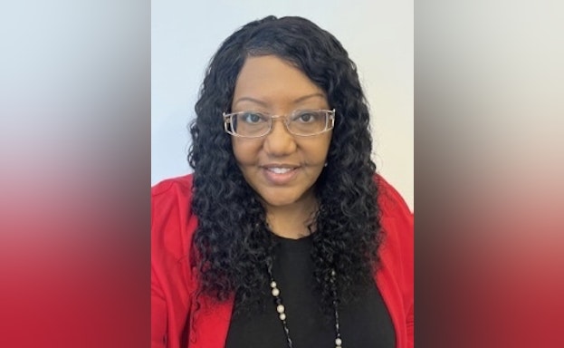 Headshot of Natasha King smiling at the camera