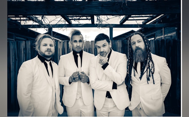 Shine down the band poses in matching white suits