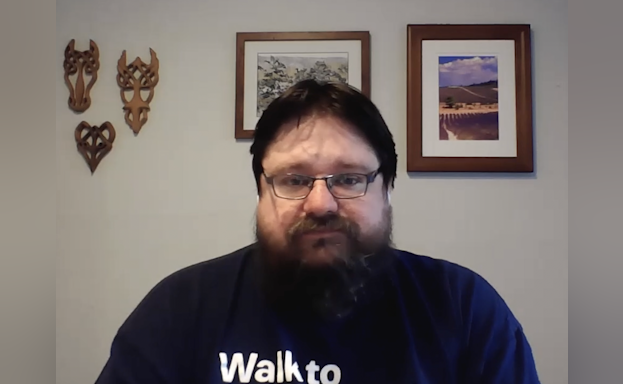 AFSP North Texas chapter volunteer William Floyd wearing a dark blue t-shirt and looking at the camera.
