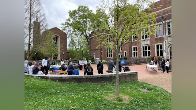 A group of people gather outside