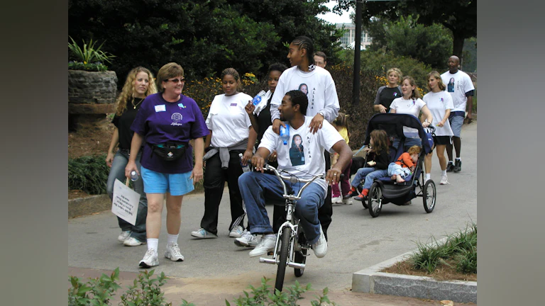 Attendees smiling and interacting at an Atlanta Out of the Darkness Community Walk