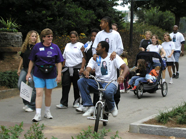 Attendees smiling and interacting at an Atlanta Out of the Darkness Community Walk