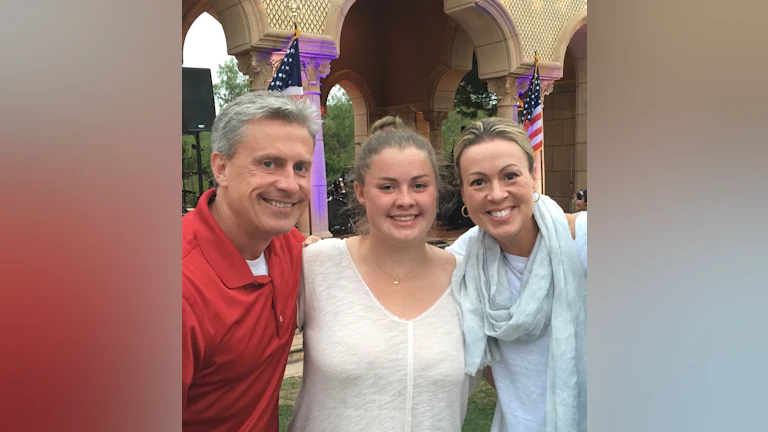 Jason, Jessica, and Kristen Walton smiling for a family photo.