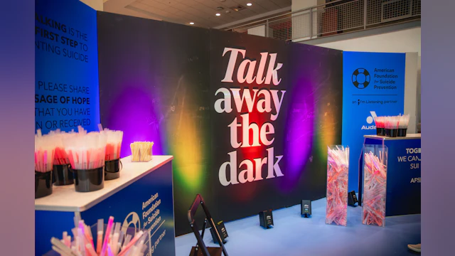 Large AFSP signage reading, "Talk away the dark"