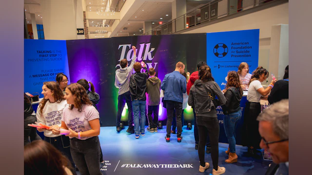 Concert attendees at AFSP's "Talk away the dark" booth
