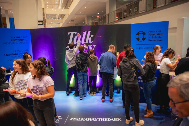 Concert attendees at AFSP's "Talk away the dark" booth