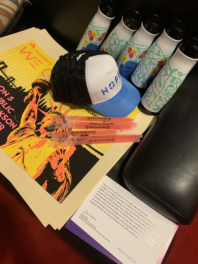 Glow bracelets, water bottles, posters, and hats available at AFSP's "Talk away the dark" booth