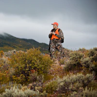 Hunter looking over a valley