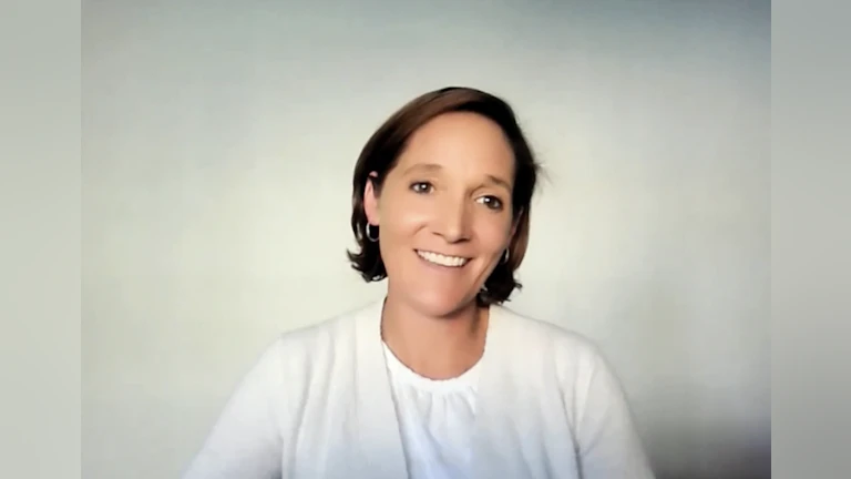 AFSP Volunteer Advocate Terri Lavely smiling in a white cardigan.