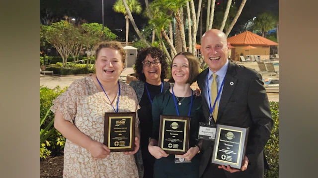 Lina, Deidra, Halli and Paul celebrate the chapter's success, holding three awards