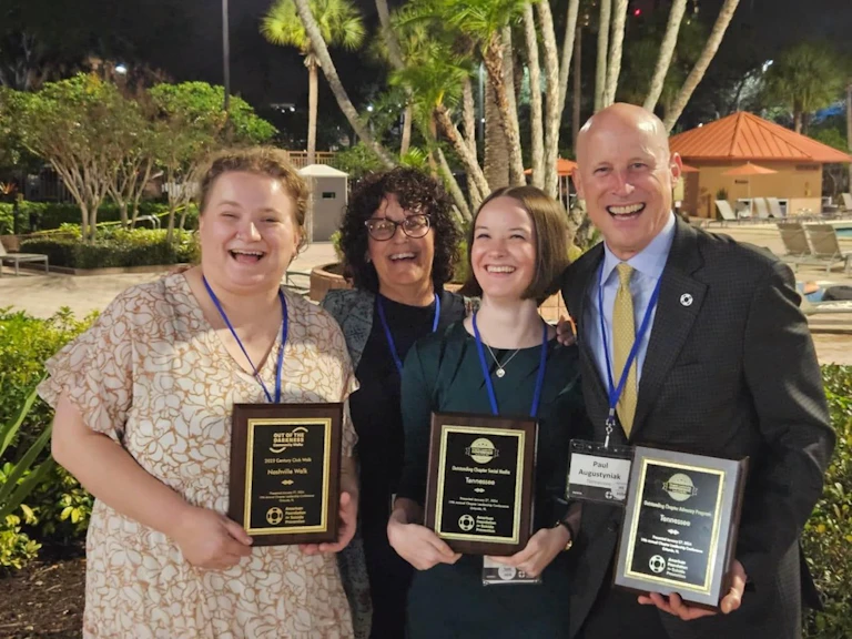 Lina, Deidra, Halli and Paul celebrate the chapter's success, holding three awards