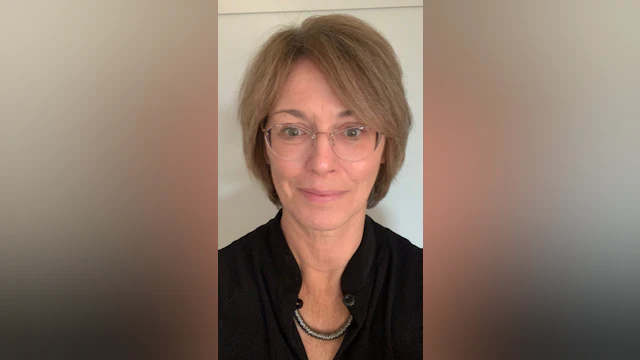 The author, Beth Brodsky, smiling and wearing a black shirt.