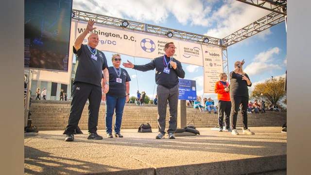 President and CEO of Pepco Holdings Tyler Anthony joined by President of the International Brotherhood of Electrical Workers Local 1900 Jerry Williford and Pepco Holdings’ Vice President Support Services Sandy Fisher during the 2023 Washington, D.C. Out of the Darkness Community Walk's Opening Ceremony