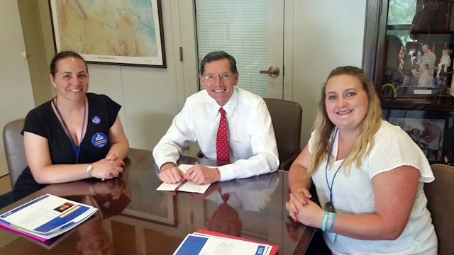 The author Donna Birkholz, left, with Senator John Barrasso of Wyoming, middle.
